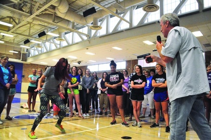 Former Navy Seal Al Horner and instructor Karla Rapp demonstrate to young women and mothers at Minnetonka High School on what to do if you are attacked at gunpoint at the July 22 course. (Sun Sailor p